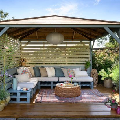 garden pergola with screen and bench seating
