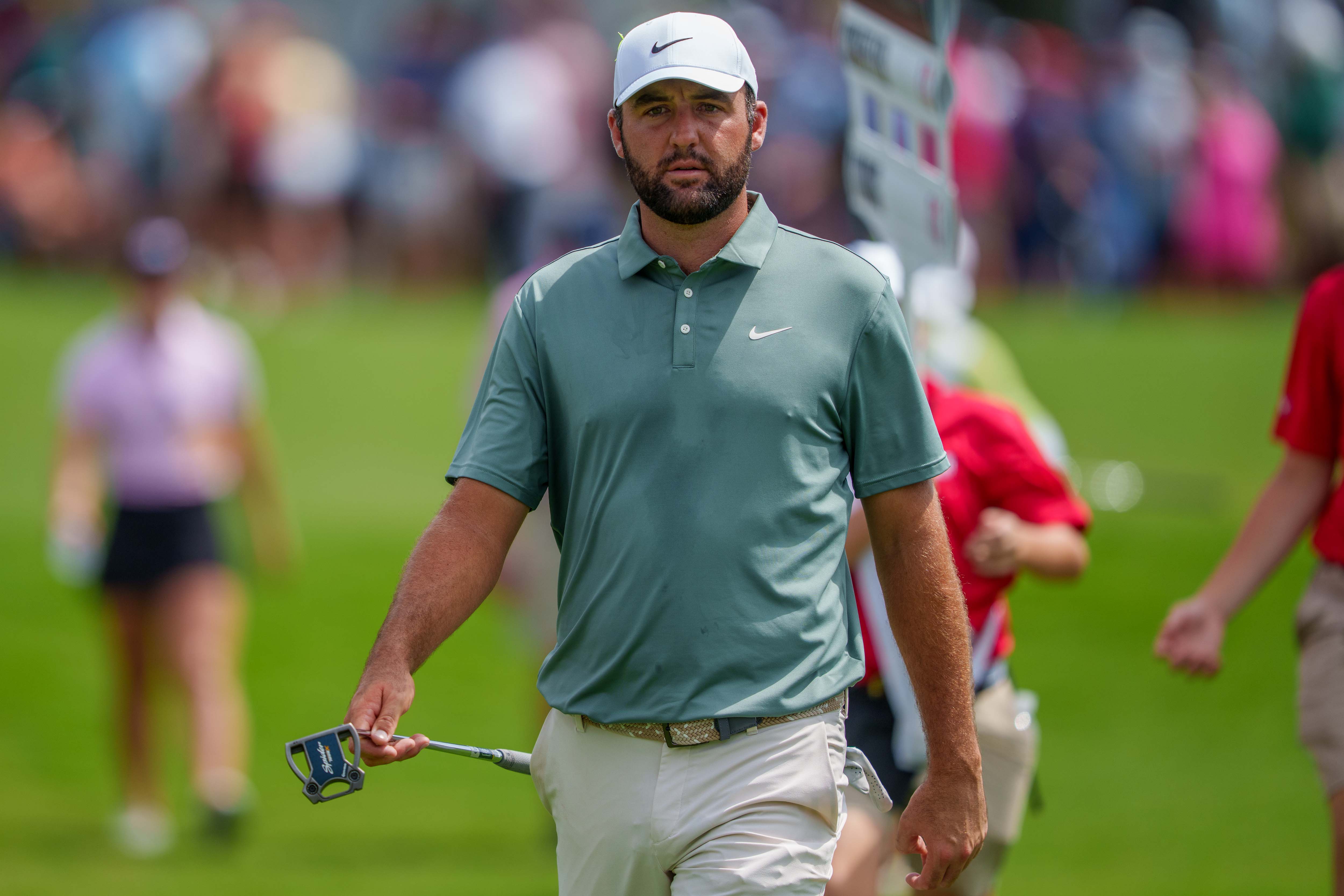 Scottie Scheffler walks off the green