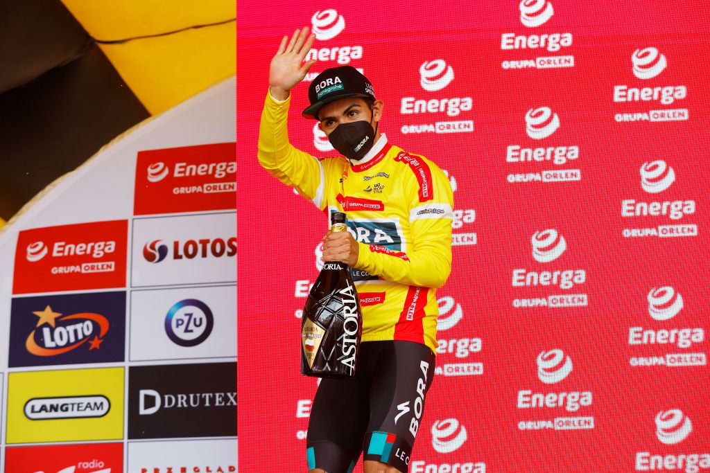 SANOK POLAND AUGUST 02 Sergio Andres Higuita Garcia of Colombia and Team Bora Hansgrohe celebrates winning the Yellow Leader Jersey on the podium ceremony after the 79th Tour de Pologne 2022 Stage 4 a 1794km stage from Lesko to Sanok TdP22 WorldTour on August 02 2022 in Sanok Poland Photo by Bas CzerwinskiGetty Images