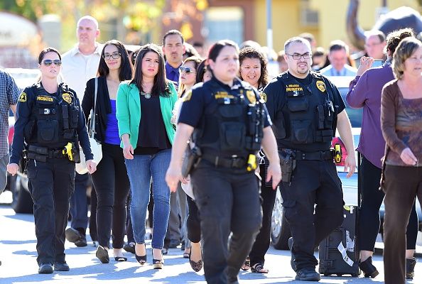 Evacuees leave the building in San Bernardino.