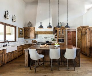 A Spanish style kitchen with wooden cabinetry and colorful ceramics