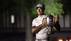 Aaron Rai holds the Wyndham Championship trophy