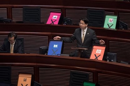 A pro-democracy Hong Kong lawmaker argues against a Beijing-backed electoral reform bill