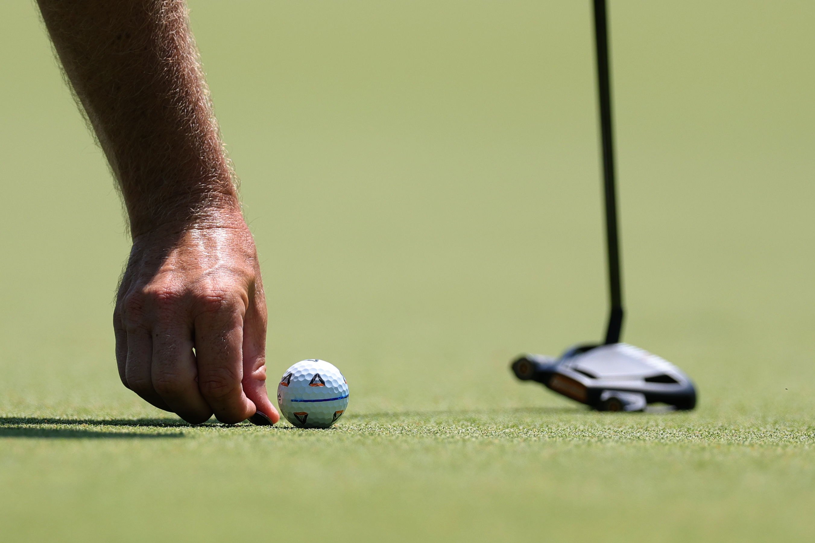 Tommy Fleetwood lines up a putt