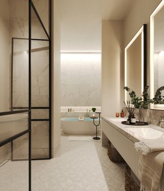 A modern bathroom with white colour theme, marble double sink to the right, illuminated double mirrors, a large bath