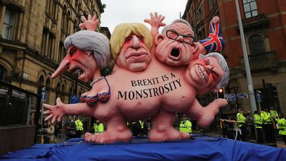  A model of Theresa May and Boris Johnson and other Conservative MP's is displayed as anti-Brexit rally in Manchester
