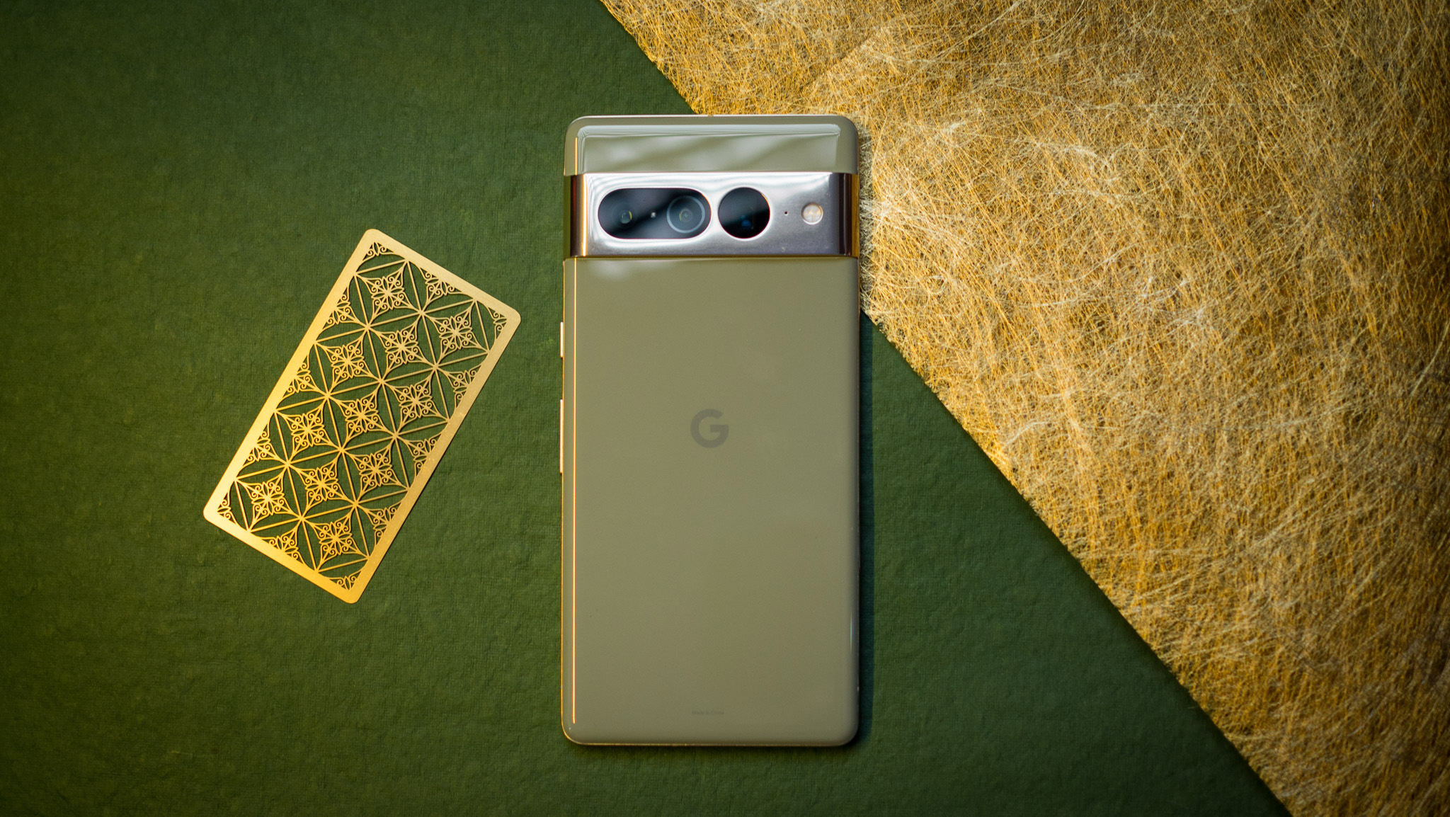 Google Pixel 7 Pro back view straight on angle against green background