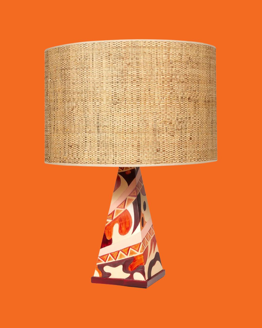 Arty Table Lamp in Terracotta by Laura Gonzalez against orange background.