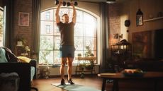 A man exercising with dumbbells 