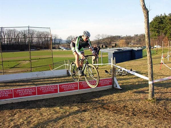 Race winner Jeremy Powers bunny hops the barriers.