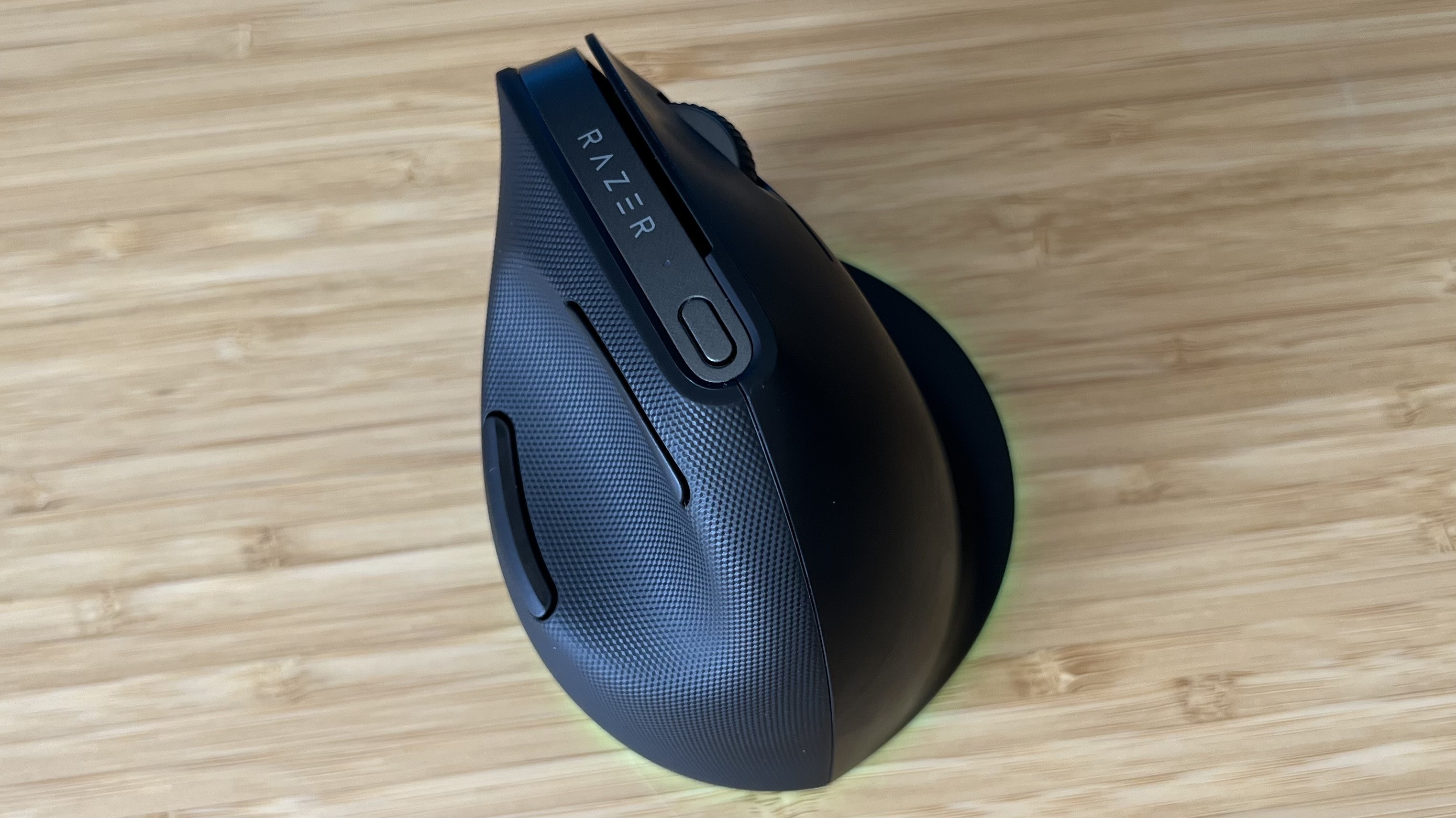 Top down view of Razer Pro Click V2 Vertical Edition gaming mouse on a wooden desk