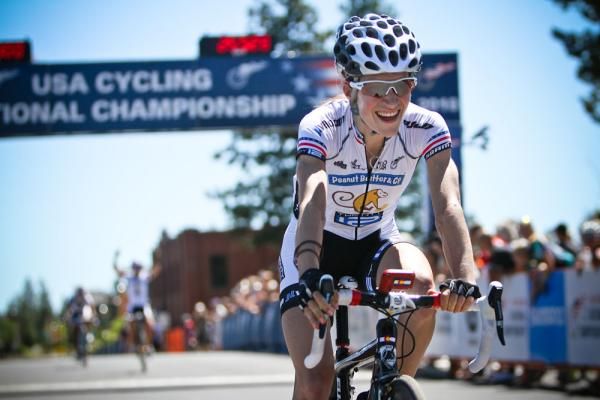 Mara Abbott (Peanut Butter &amp; Co./TWENTY 12) smiles as her teammate celebrates in the background.