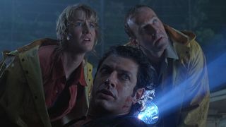 Laura Dern, Bob Peck, and Jeff Goldblum with concerned looks in Jurassic Park.