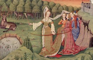 Circa 1450, a group of ladies on the grounds of a castle watch one of their number as she prepares to shoot a stag with a bow and arrow.