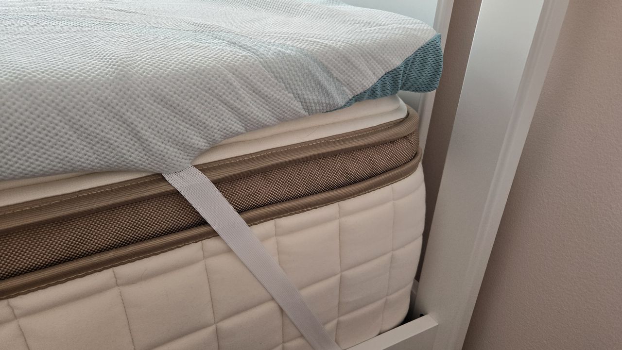 The straps of the Tempur-Pedic Tempur-Adapt + Cooling Topper on a 13" hybrid mattress