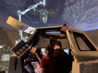 This snapshot shows NASA astronauts Bob Hines and Kjell Lindgren and European Space Agency astronaut Samantha Cristoforetti practicing capturing visiting vehicles like a Cygnus cargo spacecraft from the International Space Station. Hines and Lindren have been announced as part of the crew for SpaceX's Crew-4 mission, which will send astronauts aboard a SpaceX Crew Dragon spacecraft to the space station. The next SpaceX Crew launch is Crew-2, which is set to launch in April, 2021.