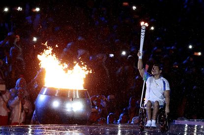 Swimmer Clodoaldo Silva of Brazil lights the Paralympic flame during the Opening Ceremony of the Rio 2016 Paralympic Games.