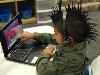 An elementary student at Val Verde (CA) Unified School District engages in learning with his Chromebook.