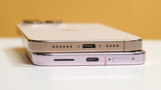 Closeup of USB-C ports on iPhone 16 Pro Max vs Pixel 9 Pro XL.