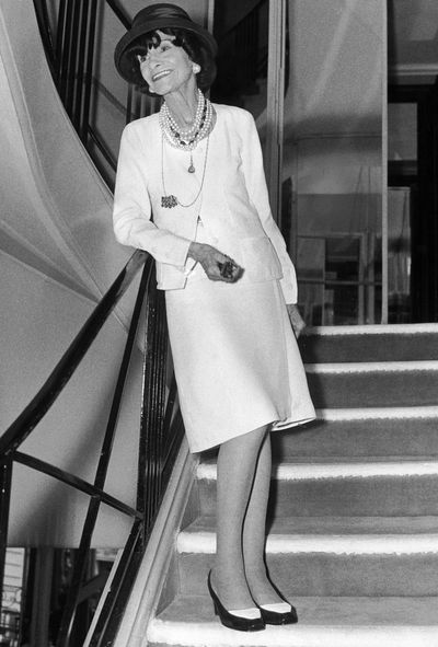 French fashion designer Coco Chanel wearing her gown