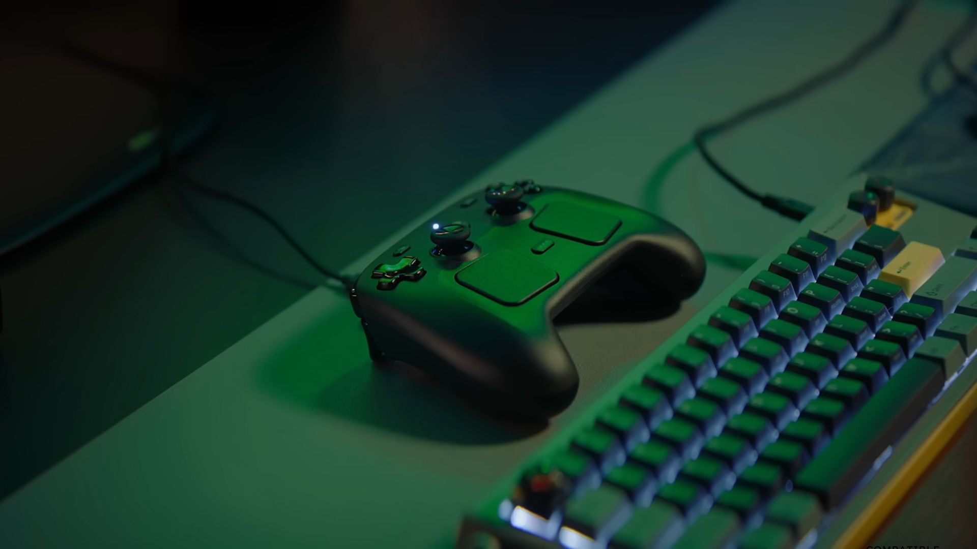A Steam Controller on its magnetic charging puck under green lighting