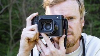 Fujifilm GFX100 RF held up to photographer's eye