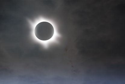 The spiky halo of light around the blotted-out solar disk is the plasma from the sun's outer atmosphere or corona.
