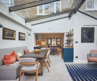 modern kitchen diner extension with glass roof and banquette seating