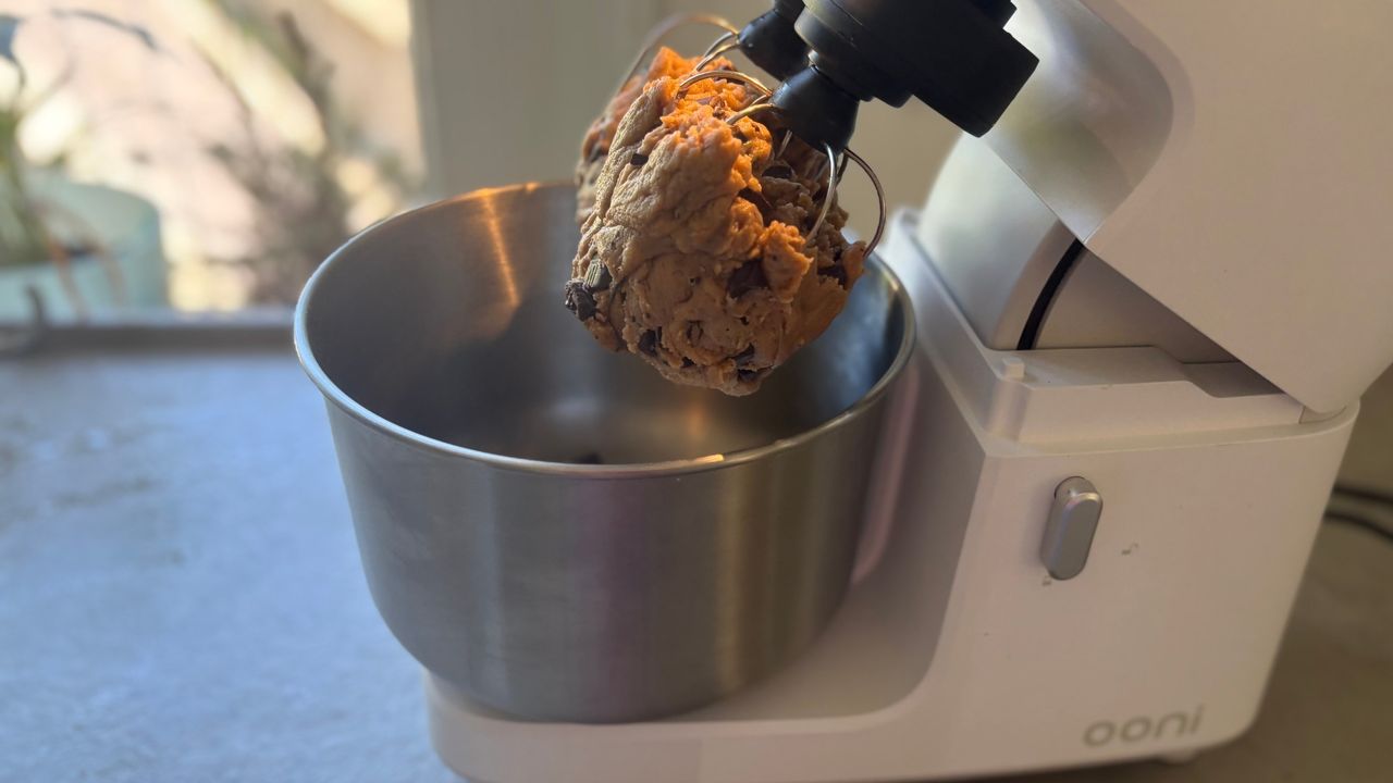 Testing the Ooni Halo Core Stand Mixer showing cookie dough in the whisks