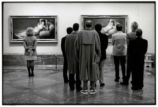 people viewing portrait in gallery