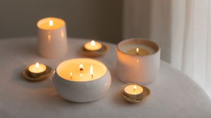 selection of different sized lit scented candles