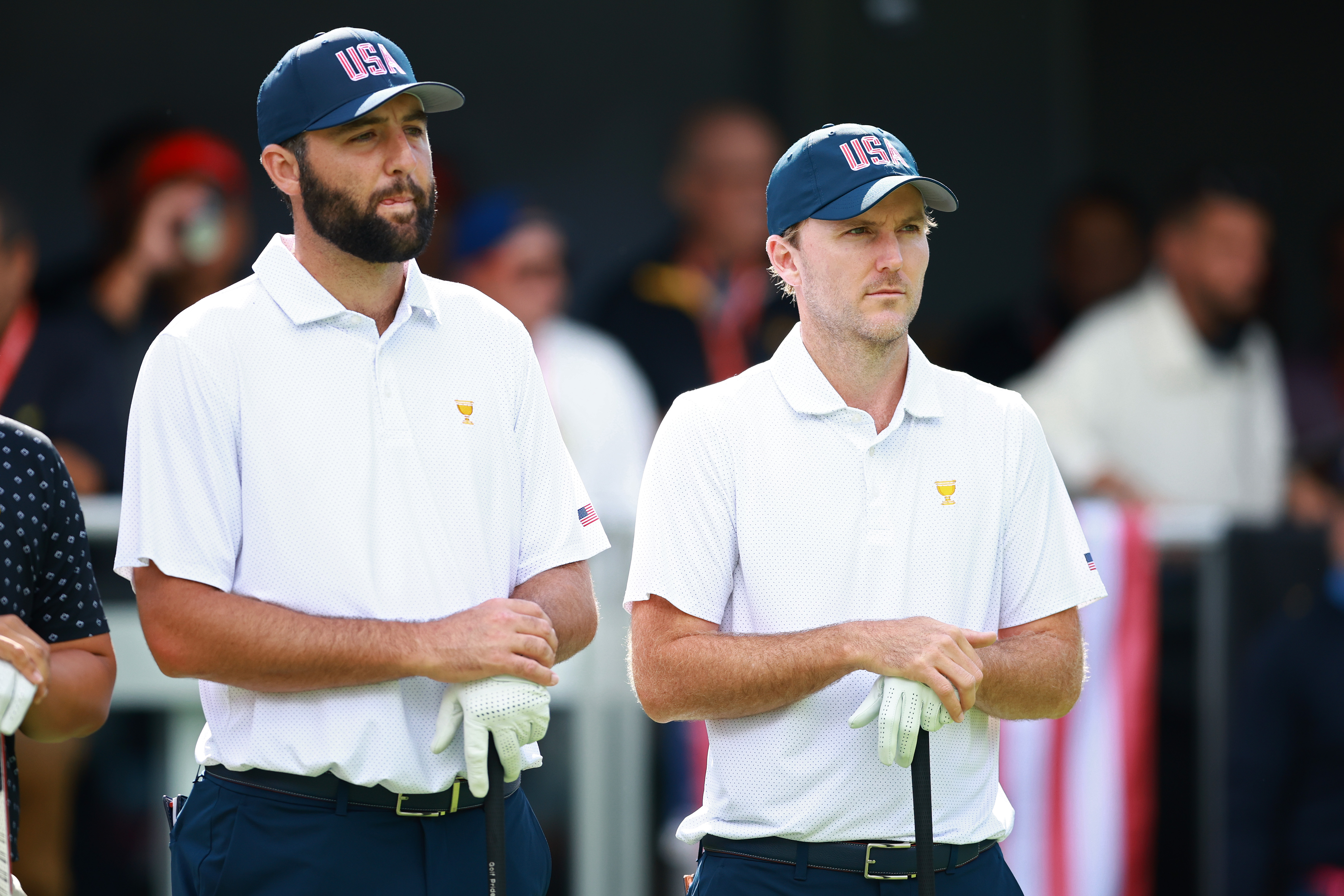 Scottie Scheffler and Russell Henley wait on the tee box