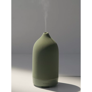green ceramic diffuser with steam coming out