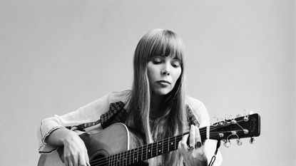 Joni Mitchell playing guitar 