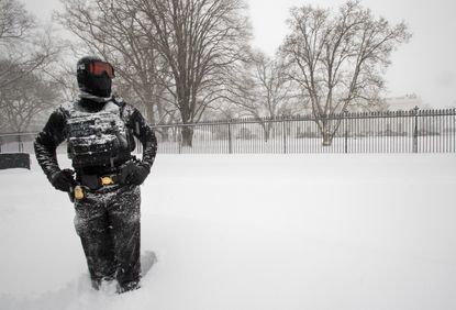 Secret Service officer stands guard outside the White House