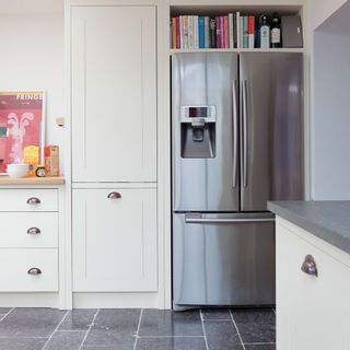 Kitchen with smart refrigerator and white cabinet