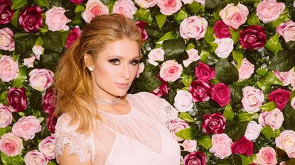 paris hilton on a background of roses