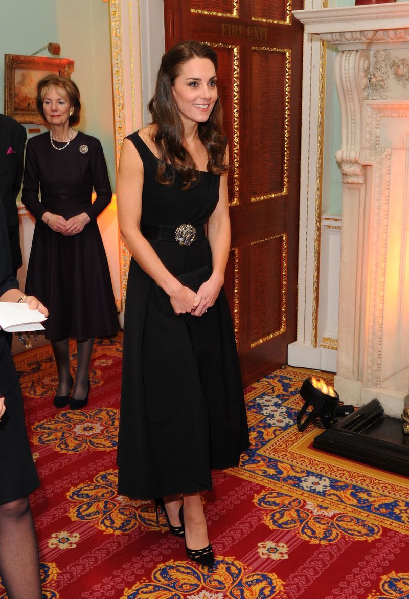 Clothing, Dress, Carpet, Formal wear, Little black dress, Fashion, Room, Flooring, Event, Long hair,