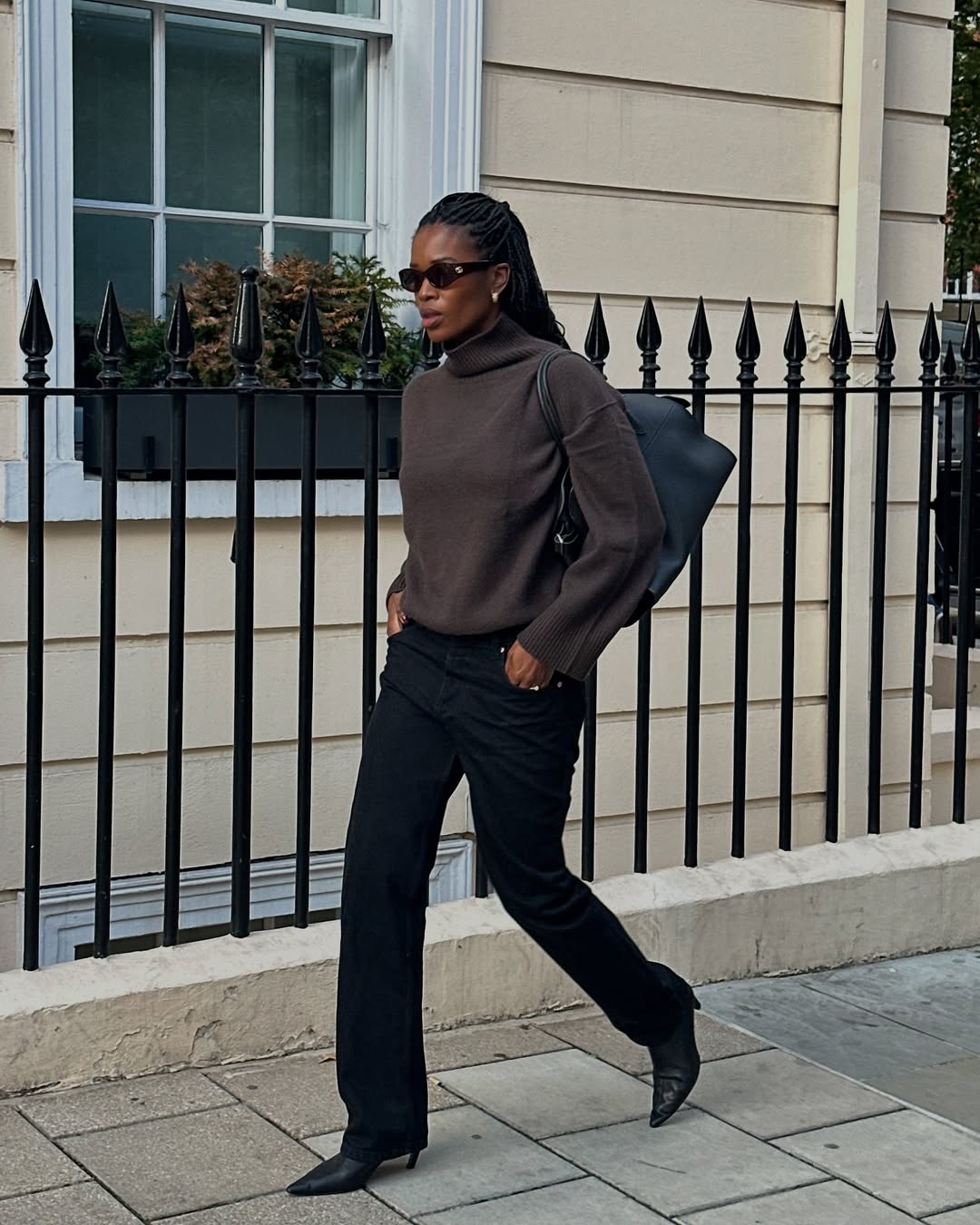 Marilyn in brown turtleneck and black jeans