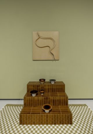 Formafantasma tiles on a checkered rug by Wieki Somers