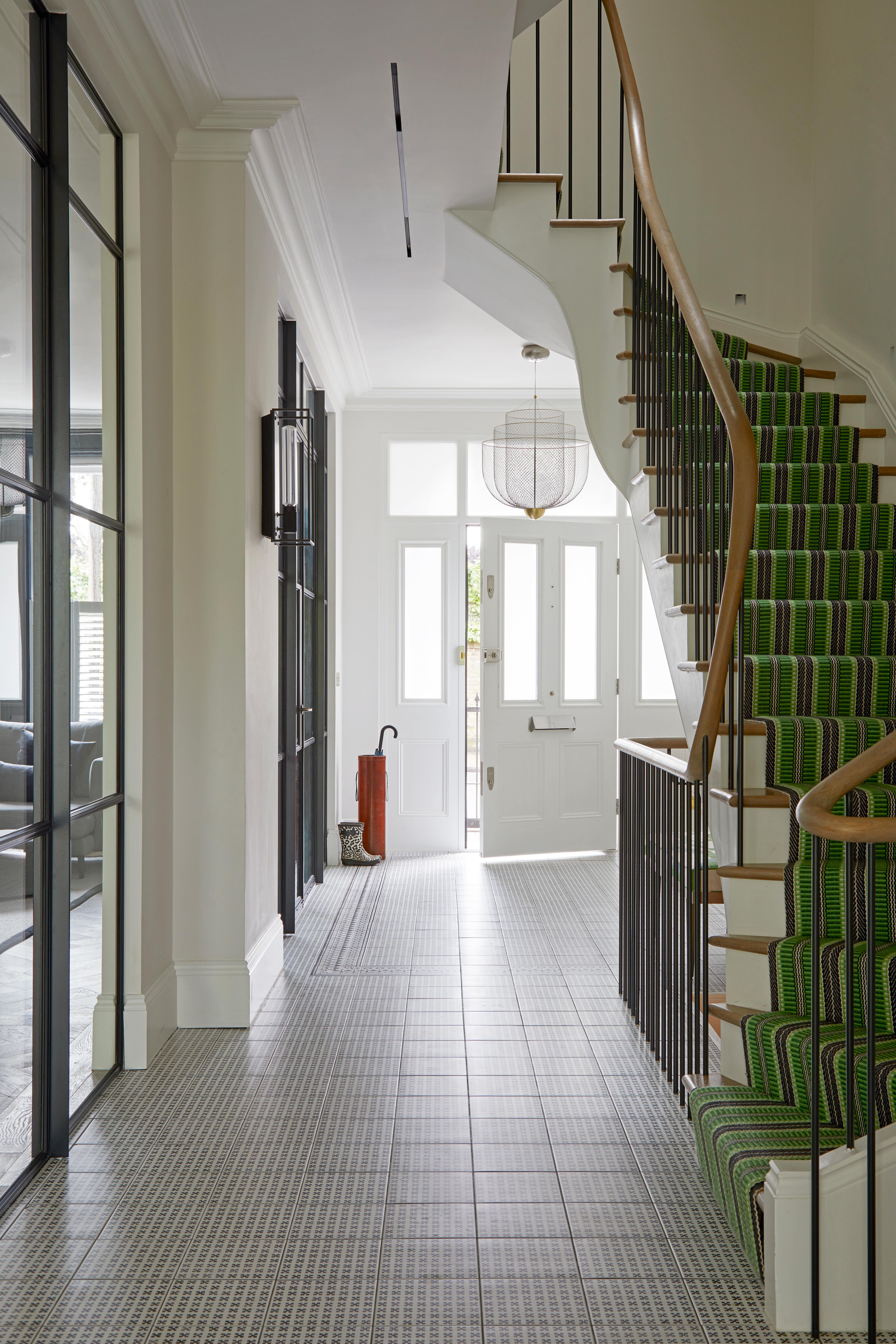 Large hallway with striped green runner