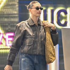 Hailey Bieber is seen on January 05, 2025 in Los Angeles, California with Justin Bieber in a leather jacket and a suede Bottega Veneta Hop Bag.