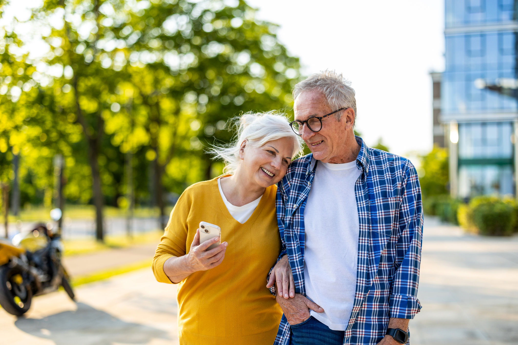 Older couple walking in a city