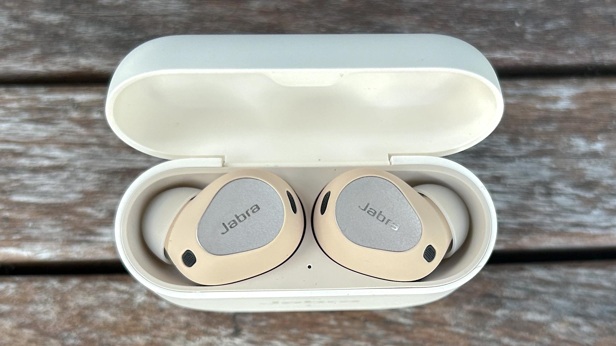 Jabra Elite 10 close up of earbuds in charging case with lid open