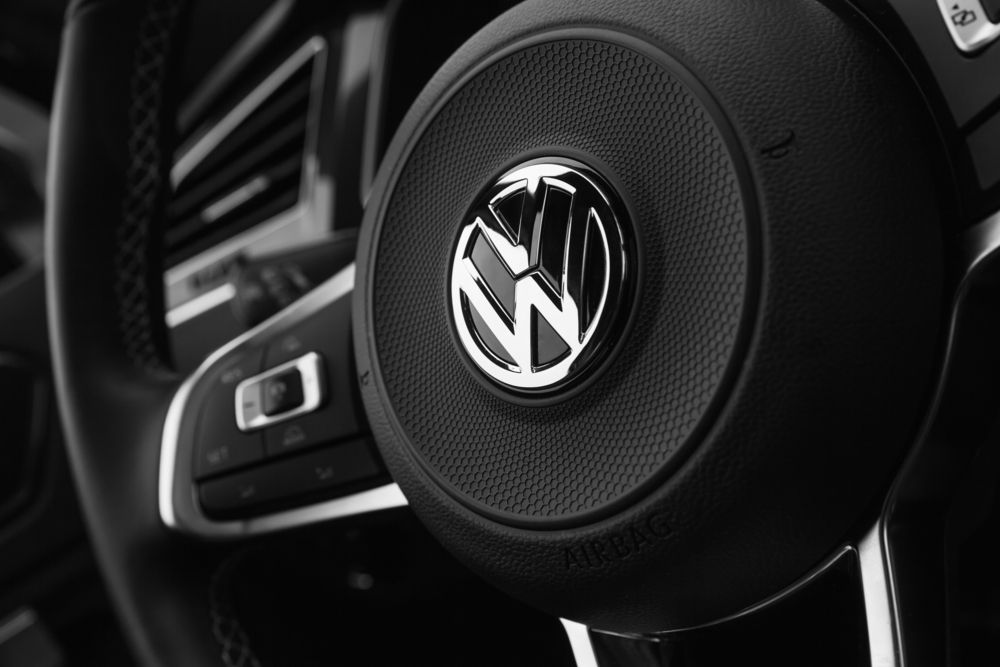 A steering wheel and dashboard from a Volkswagen car