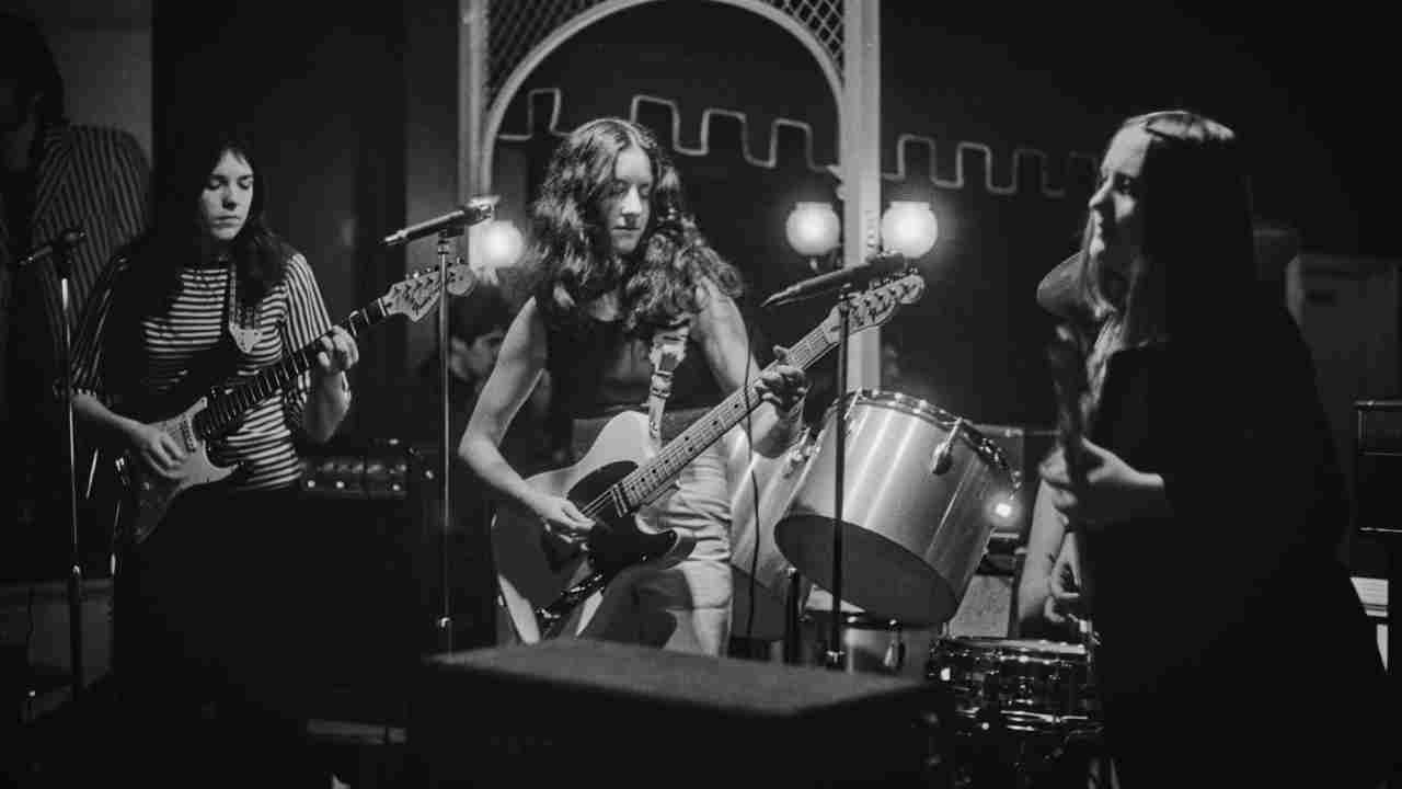 Girlschool performing onstage in 1977