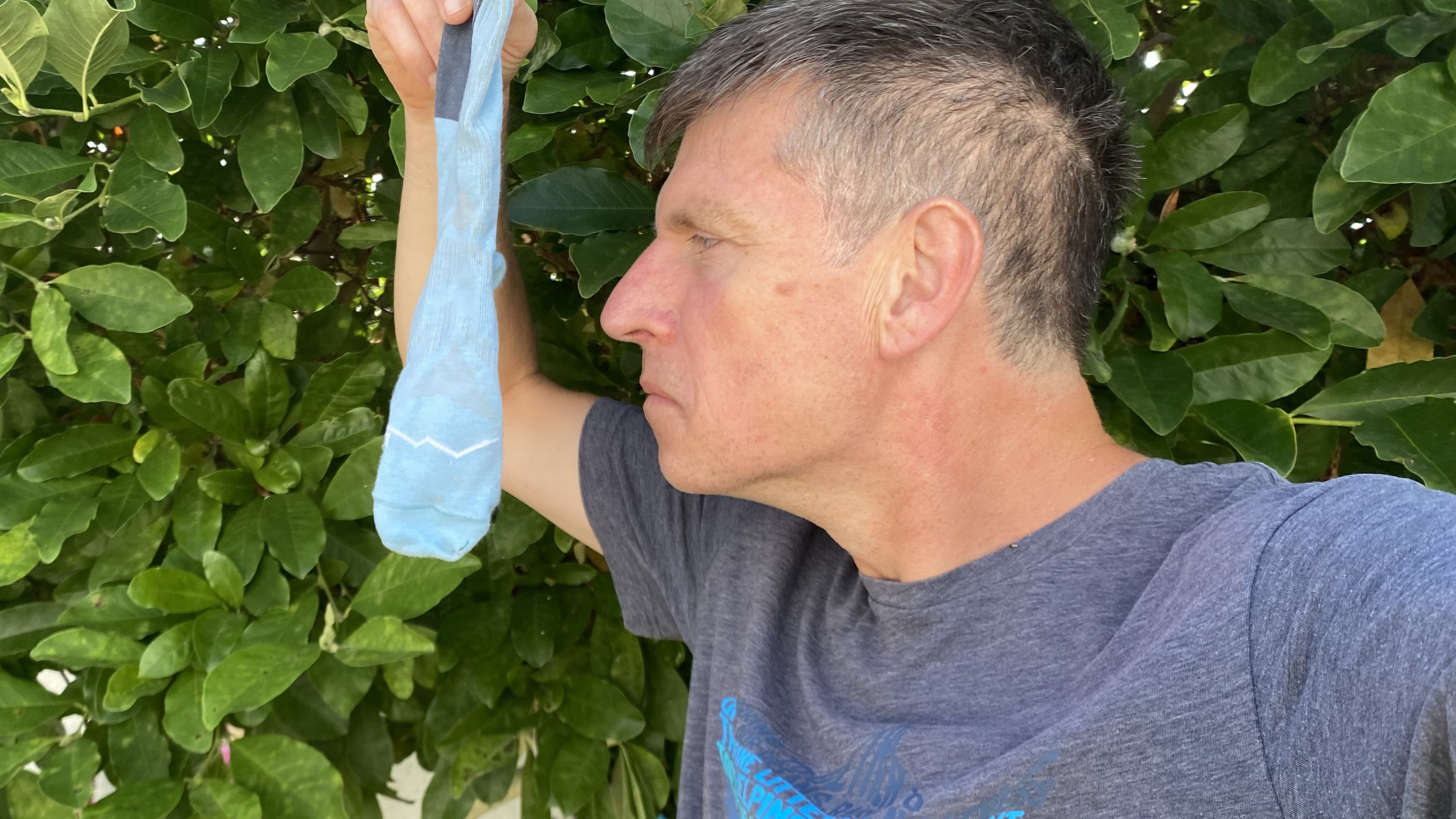 Performing the post-run sniff test on the Buff CoolNet Crew running socks