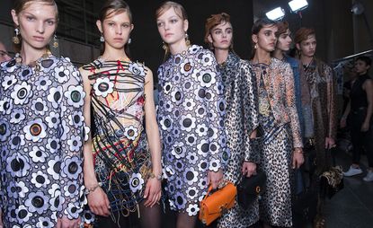 Models wearing Designer Christopher Kane's outfits