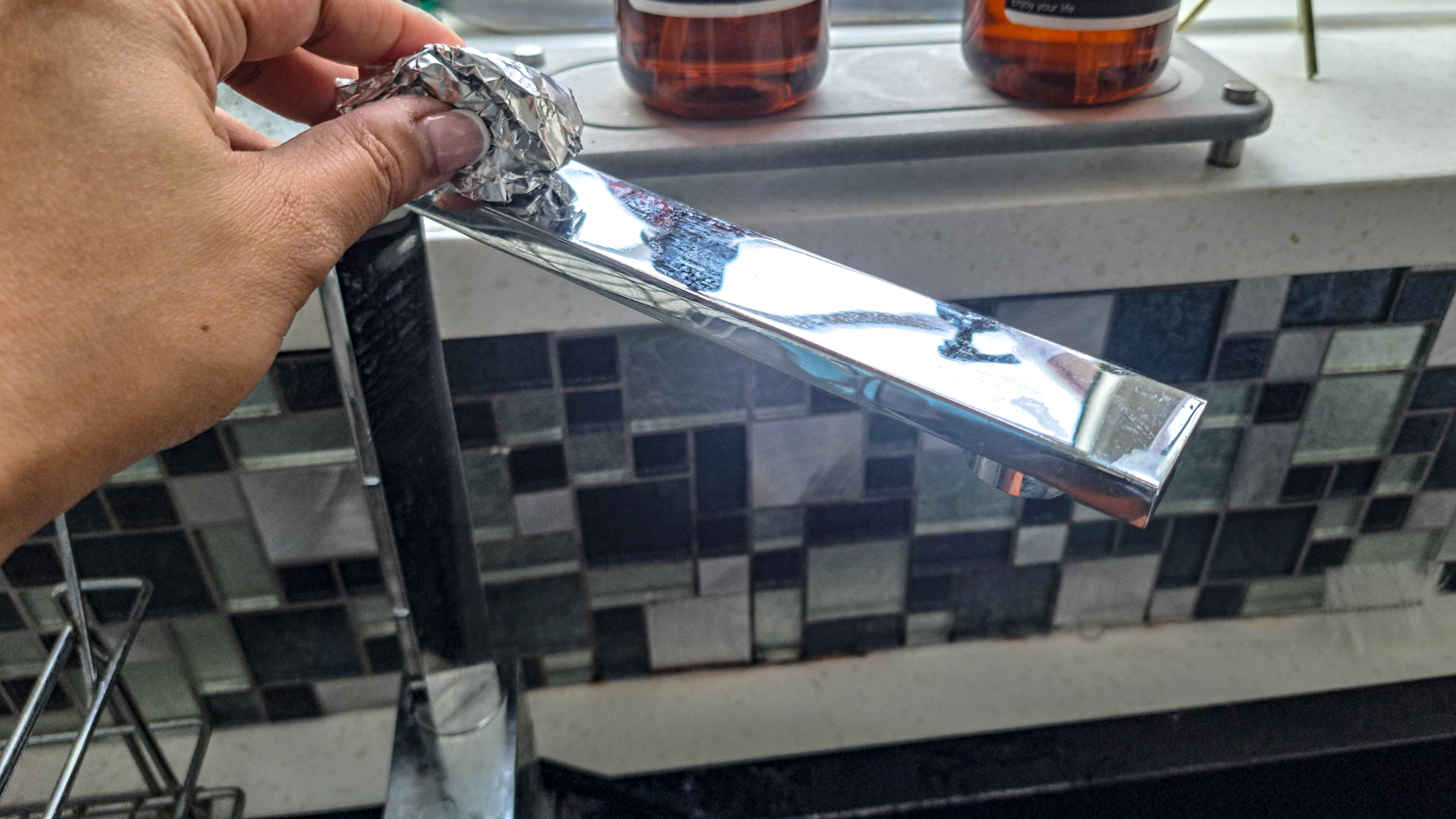 Cleaning faucet with foil