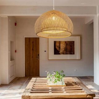 A sculptural bamboo pendant light in a dining room